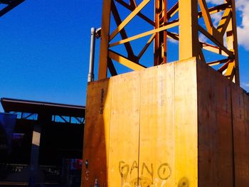 Low angle view of built structure against clear blue sky