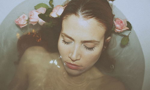 High angle view of young woman in bathtub