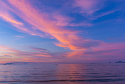 Scenic view of sea against romantic sky at sunset
