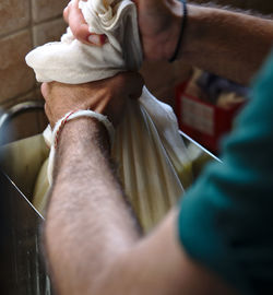 Cropped hands of man preparing food