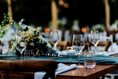 Luxury table settings for fine dining with and glassware, pouring wine to glass.beautiful background