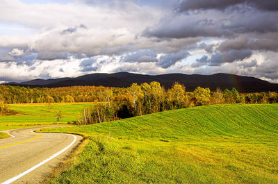 Road passing through field