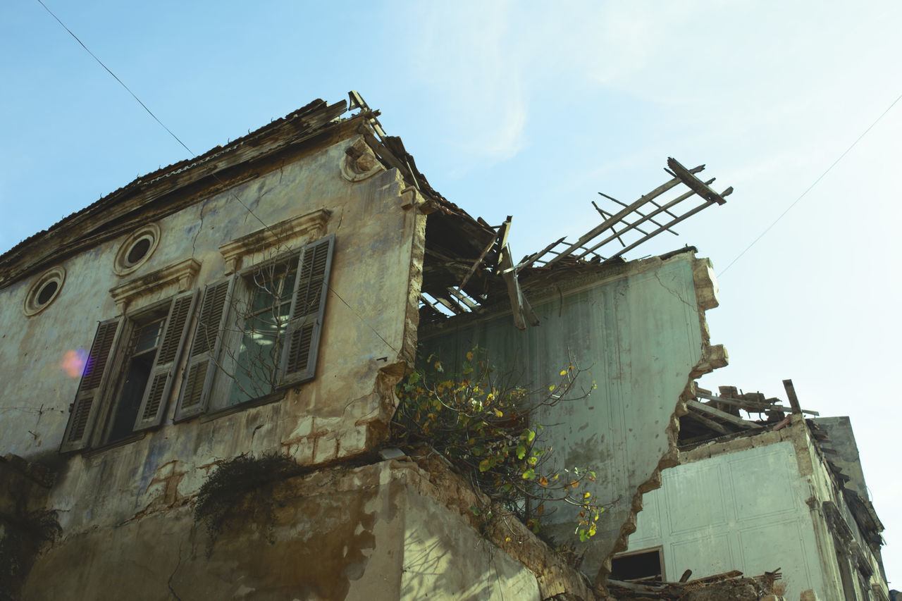 LOW ANGLE VIEW OF DAMAGED BUILDING