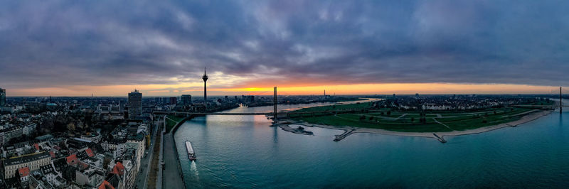 Scenic view of river against sky during sunset