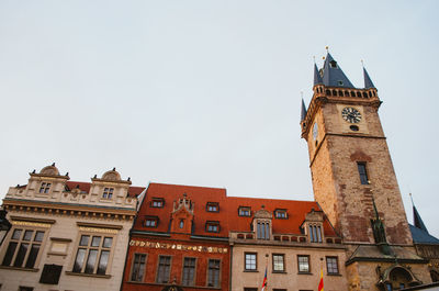 Low angle view of clock tower against sky in city