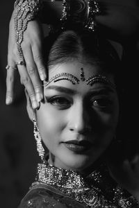 Portrait of beautiful young woman in traditional clothing