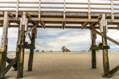 Built structure on sand against sky