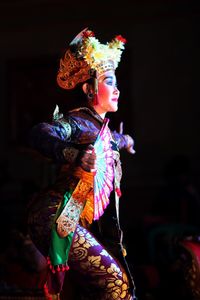 Woman in traditional clothing dancing