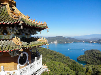 Panoramic view of sea and buildings against sky