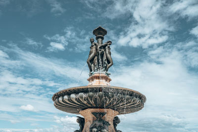 Low angle view of statue against sky