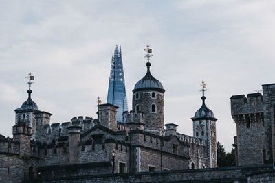 Buildings in city against sky