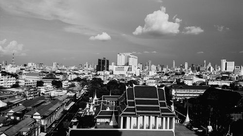 High angle view of buildings in city against sky