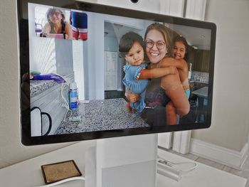 Full length of happy smiling woman at home