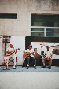 Group of people playing guitar