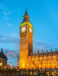 Clock tower against sky at night