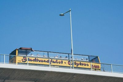 Low angle view of built structure against clear blue sky