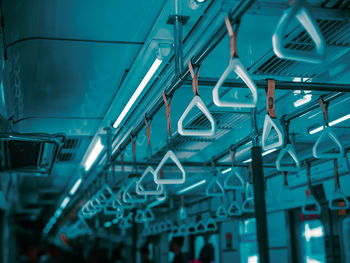 Low angle view of illuminated lights hanging from ceiling
