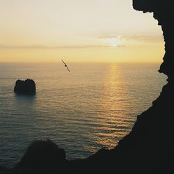 Scenic view of sea at sunset