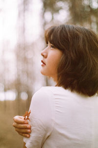 Side view portrait of a girl looking down