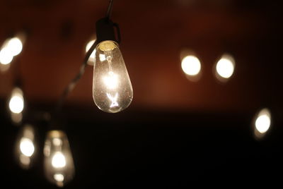 Low angle view of illuminated light bulb