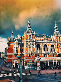 Low angle view of building against cloudy sky