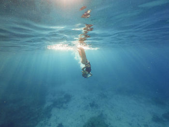 Woman swimming in sea