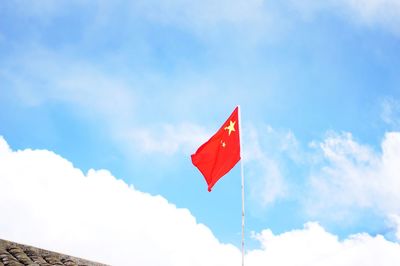 Low angle view of flag against sky