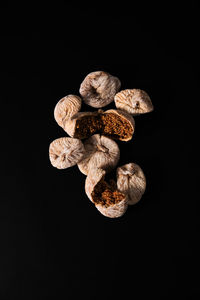 Directly above shot of dried fruits against black background