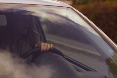 Woman relaxing in car