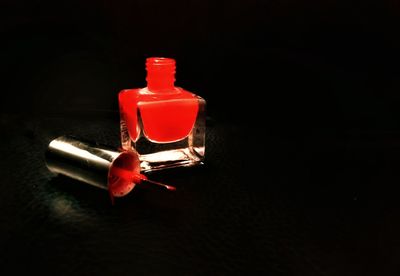 Close-up of red light on table in darkroom