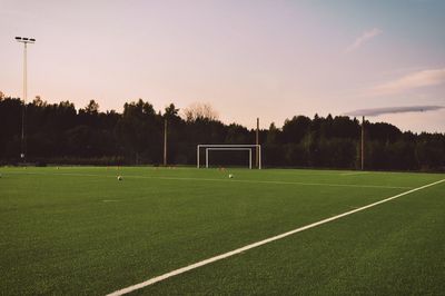 Scenic view of soccer field against sky