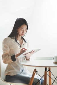 Young woman using mobile phone