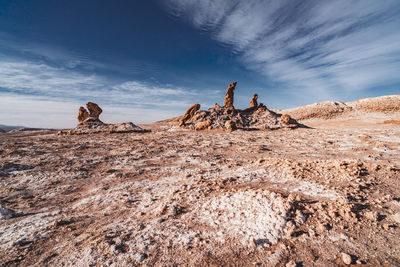 Low angle view of rock formations against sky