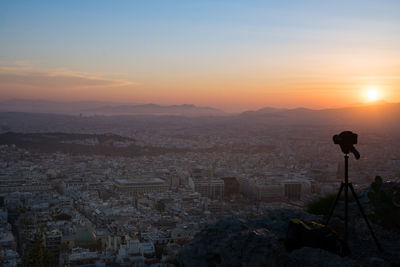 Scenic view of cityscape against sky during sunset