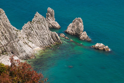 High angle view of rocks in sea