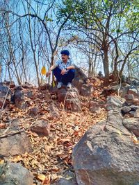 Man sitting in forest