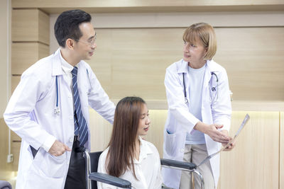 Female doctor examining patient in hospital