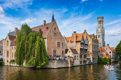 River amidst buildings against sky