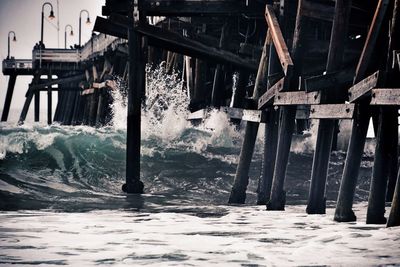 High angle view of wooden post in sea