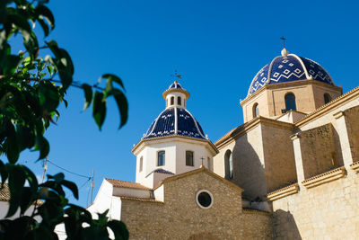 High section of church against blue sky