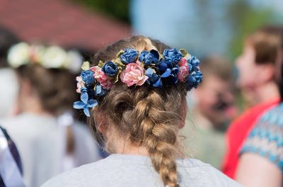 Rear view of woman wearing flowers