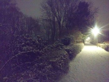 Snow covered landscape against sky