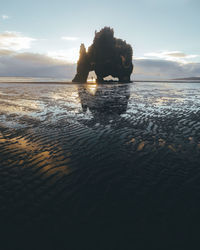 Scenic view of sea against sky at sunset