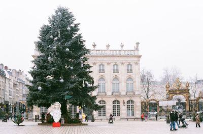 People in front of historic building