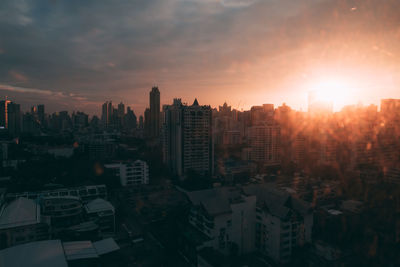 Cityscape against sky during sunset