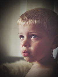 Close-up portrait of boy looking away