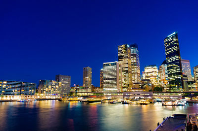 Sydney skyline of cbd, central business district and circular quay ferry station at night