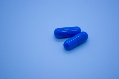 Close-up of pills on blue background