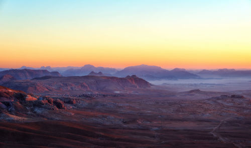 Scenic view of dramatic landscape during sunset