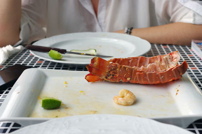 Close-up of person preparing food on table